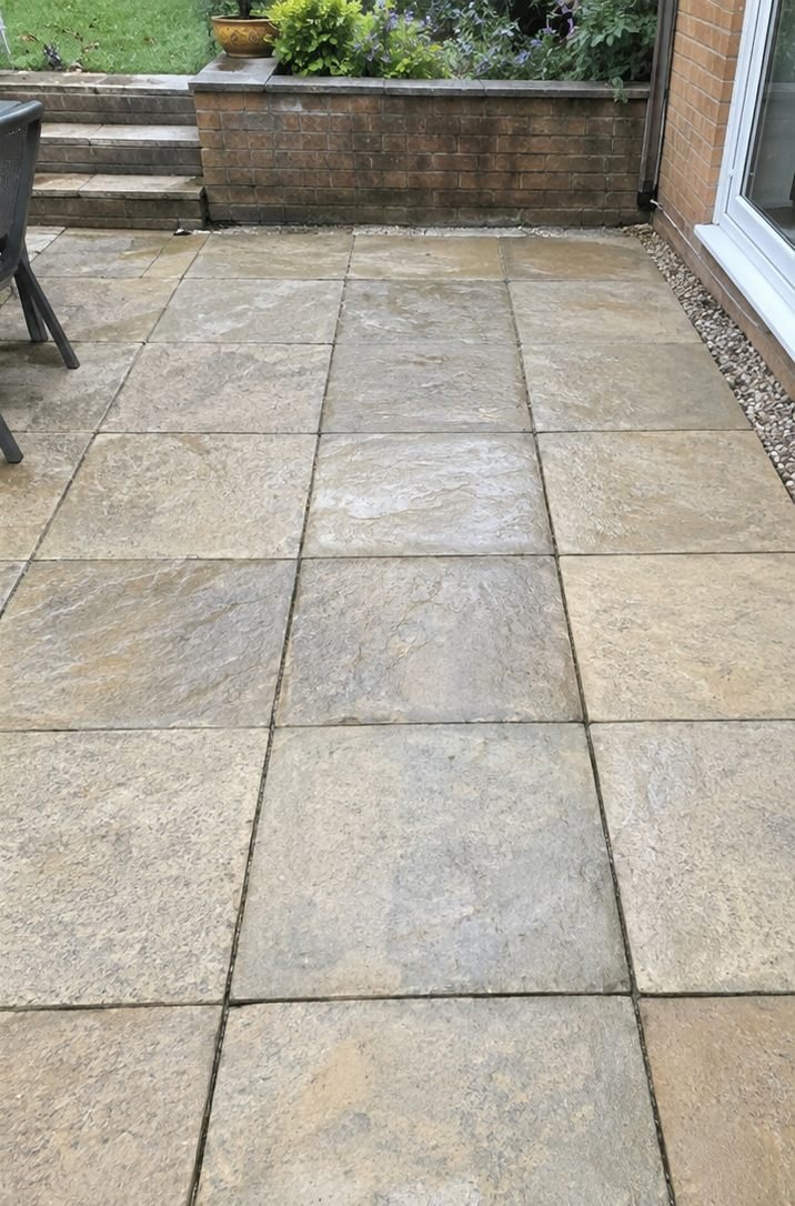 The same patio paving after soft washing